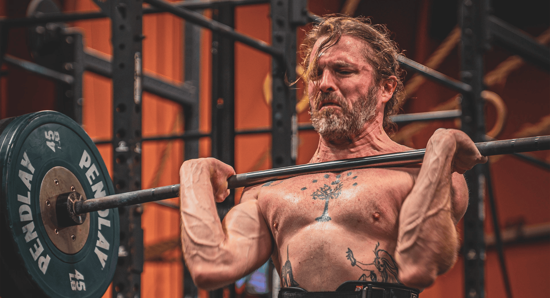 man lifting heavy weight at Rising Sun Community Fitness
